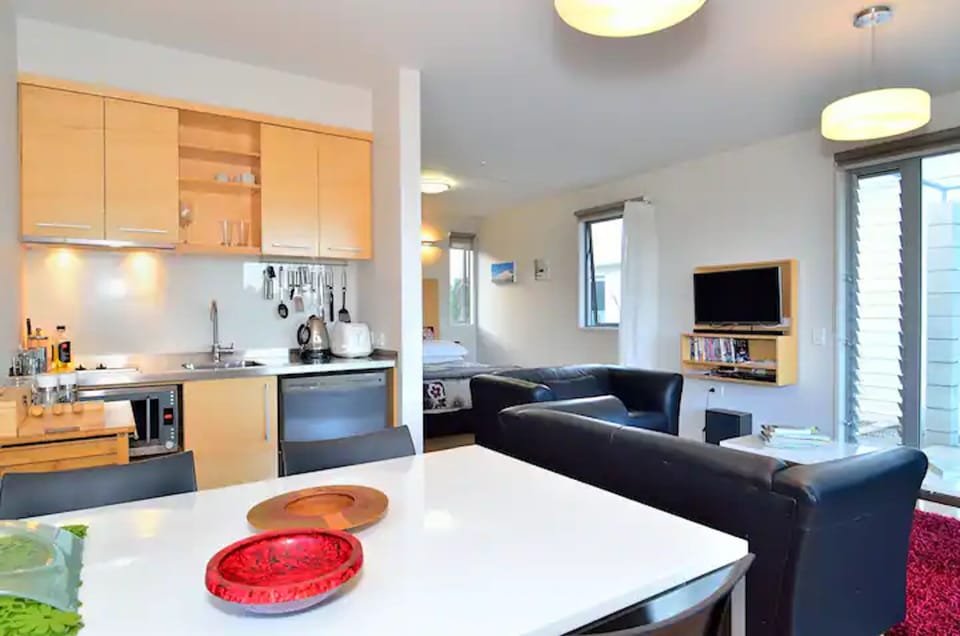 Dining area and kitchen with multi function oven, hotplates, dishwasher, fridge