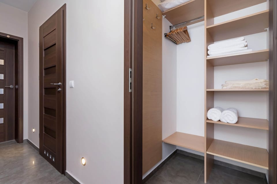 A spacious walk-in closet with ample storage.