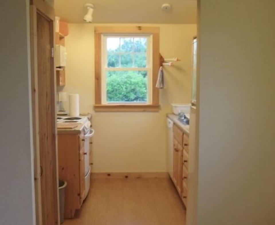 Kitchen. Window over kitchen sink (out of photo to the right) looks out on ocean