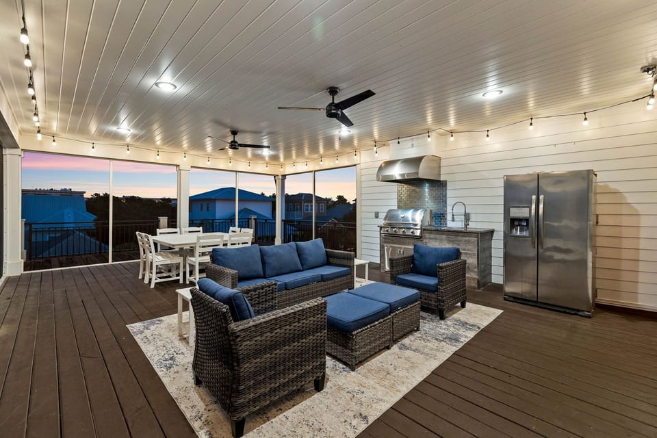 3rd Floor screened-in deck with grilling area.