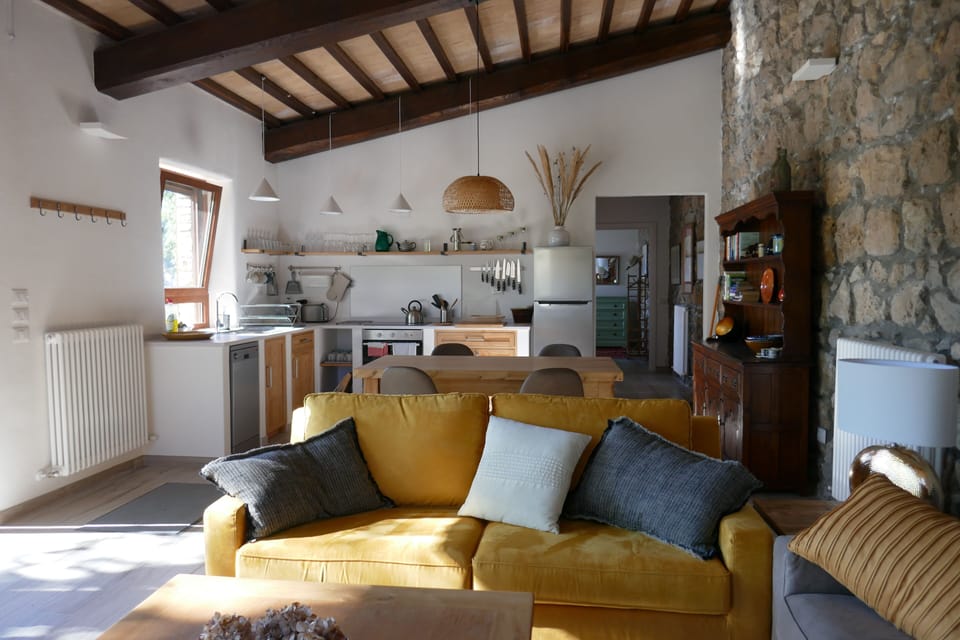 The whole living area with the kitchen at the back