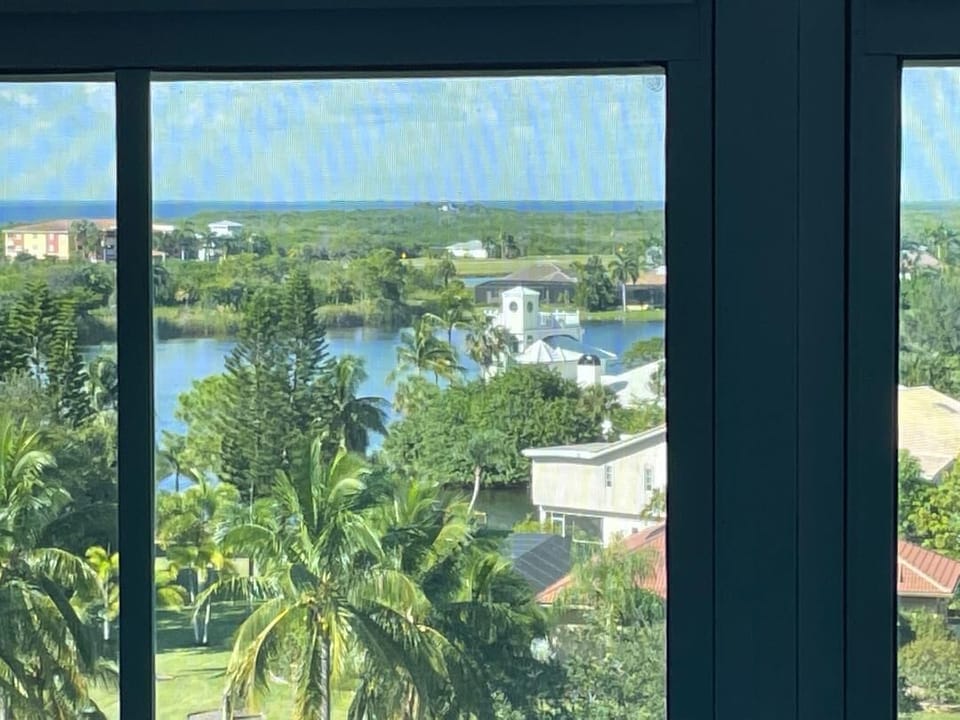 View from screened in balcony- can see bay and beautiful sunsets