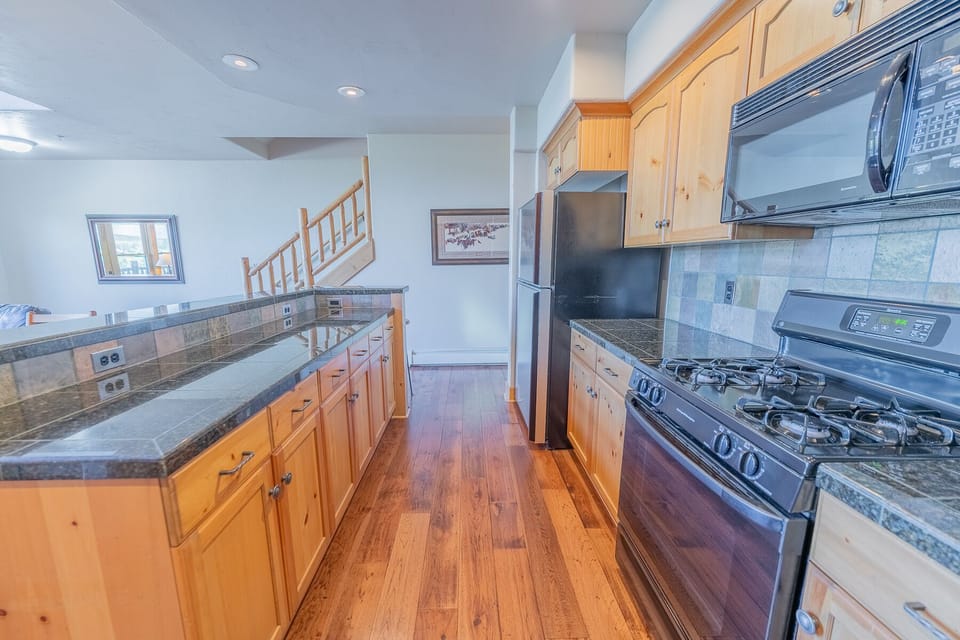 Kitchen- full kitchen with granite countertops.