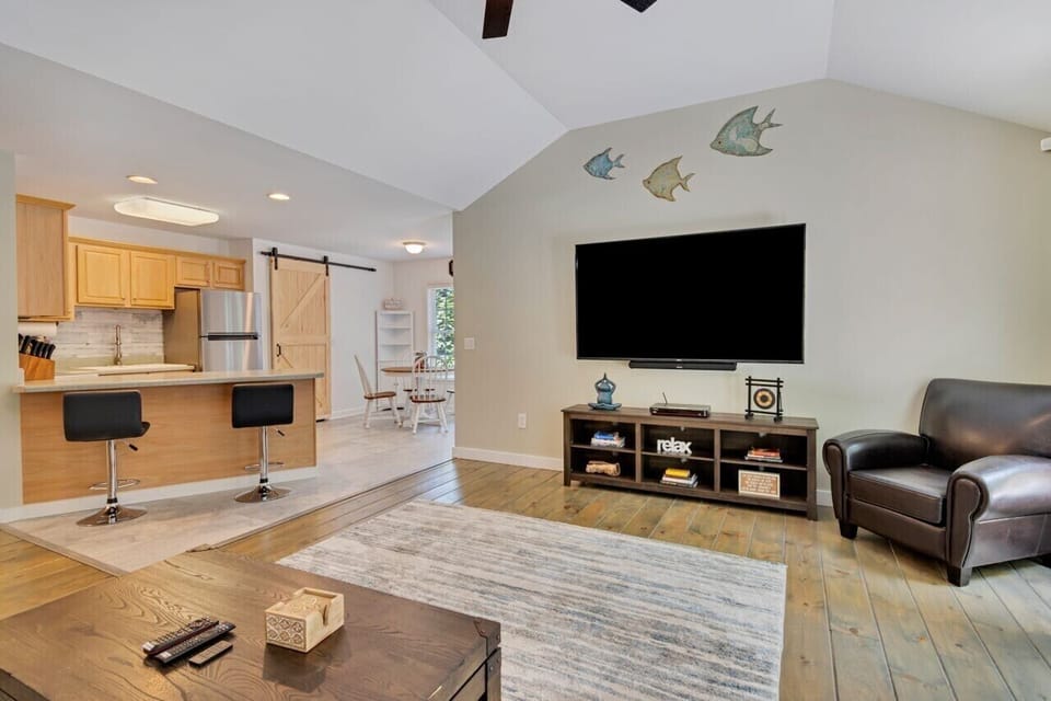 Kitchen opens into the living room with bar seating 