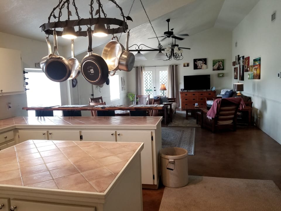 Full sized Fridge, Stove, Microwave.  Bartop with 4 stools.  