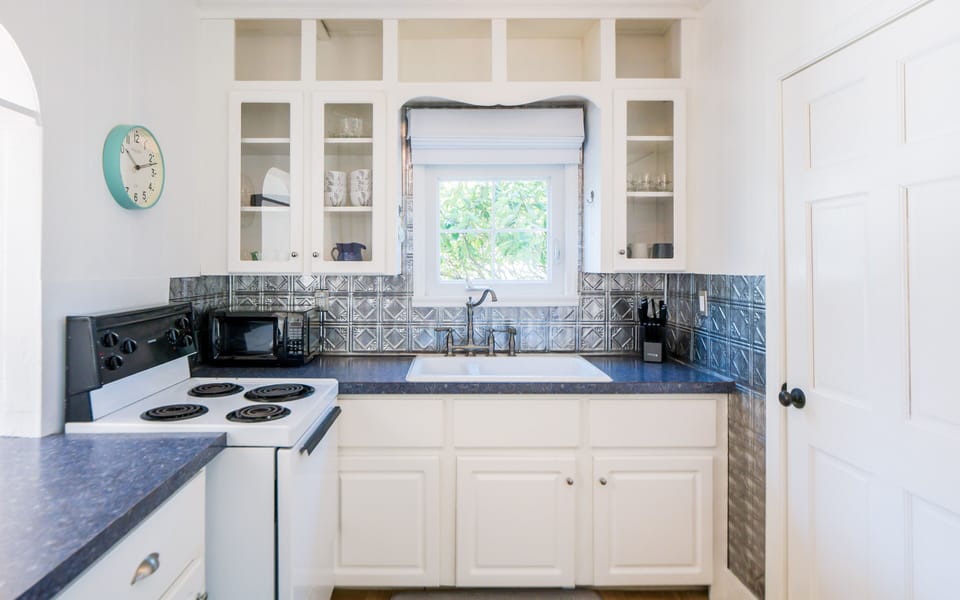 Kitchen with microwave, toaster, coffee maker and electric tea kettle