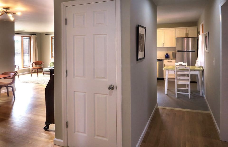 Stairs to lower level behind door.