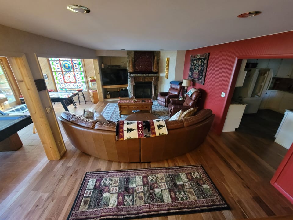 Family room with natural gas fireplace 55"  HDTV