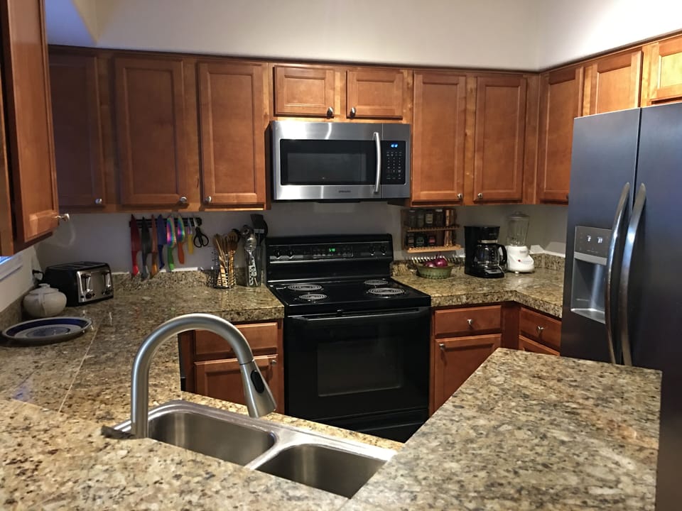 Kitchenette thoroughly equipped with cooking needs.