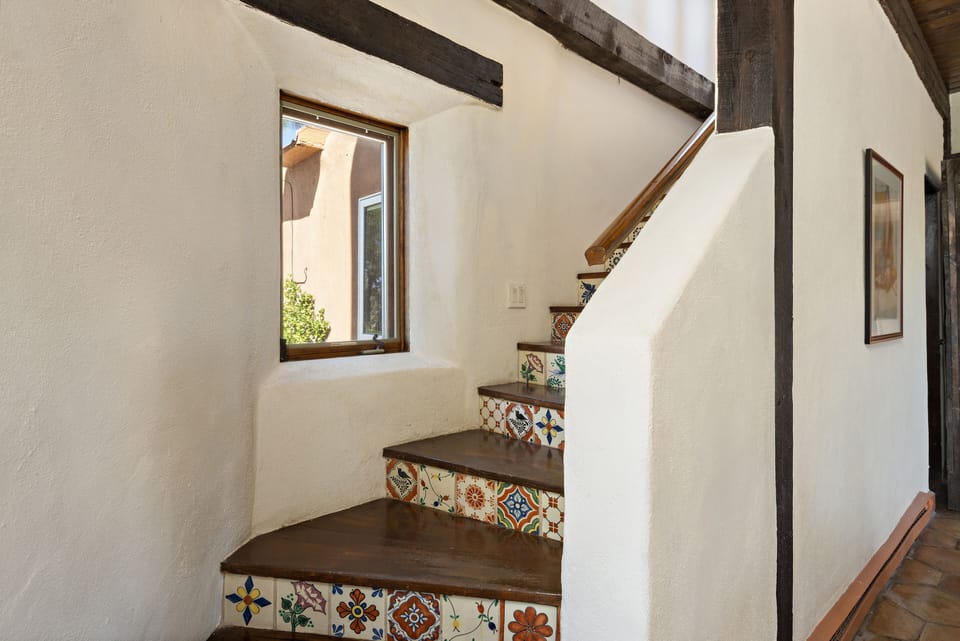 stairs to second floor ensuite primary bedroom
