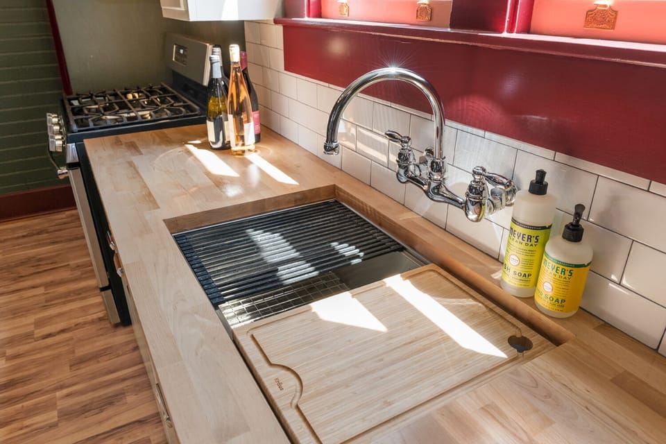 Sink with drying rack and cutting board insert