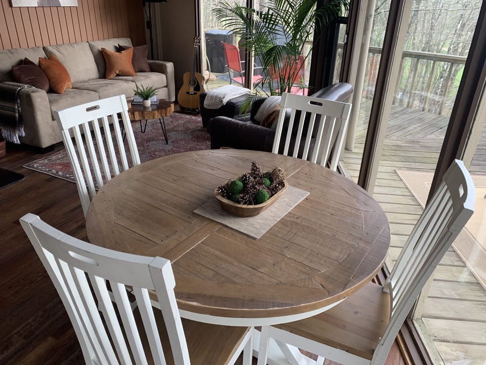 Dining area that seats 4 and can be expanded to seat 6.