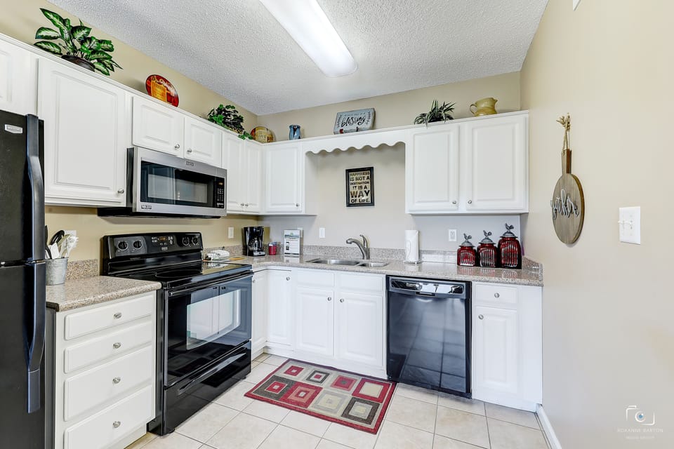 Everything You Need - Sleek modern appliances, plenty of workspace, all the cookware, dishes and utensils you’ll need…this little kitchen is a dream!