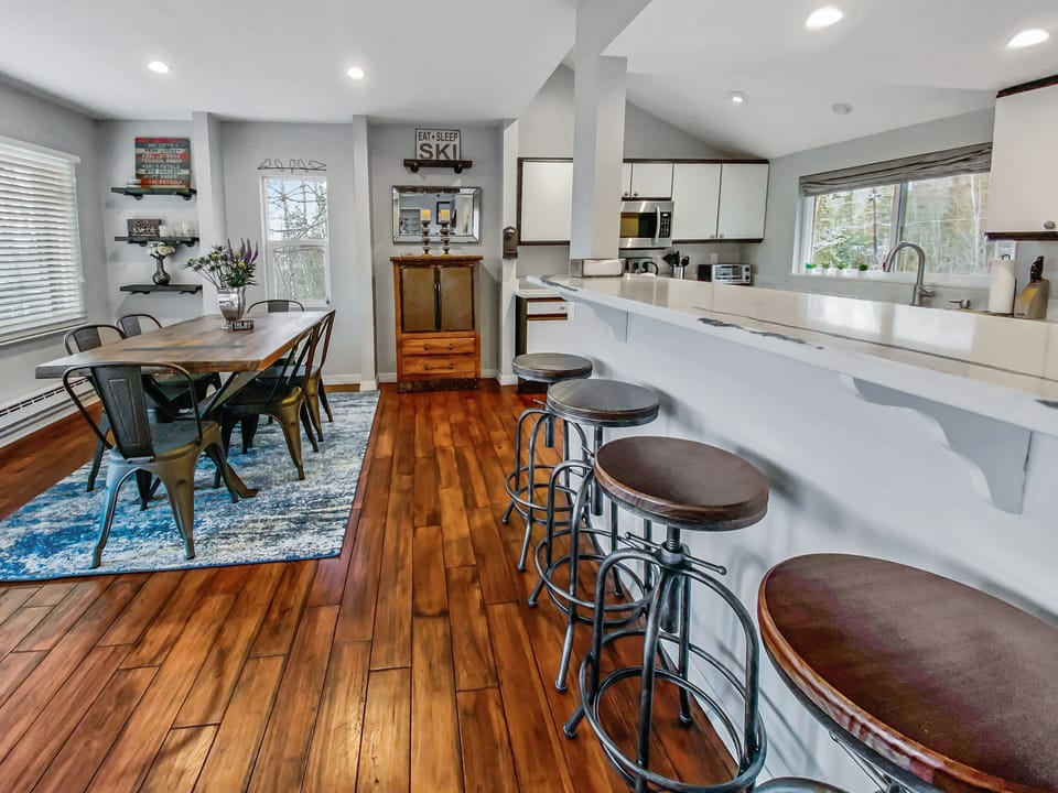 Beautifully appointed open-concept kitchen and dining area. Large breakfast bar.