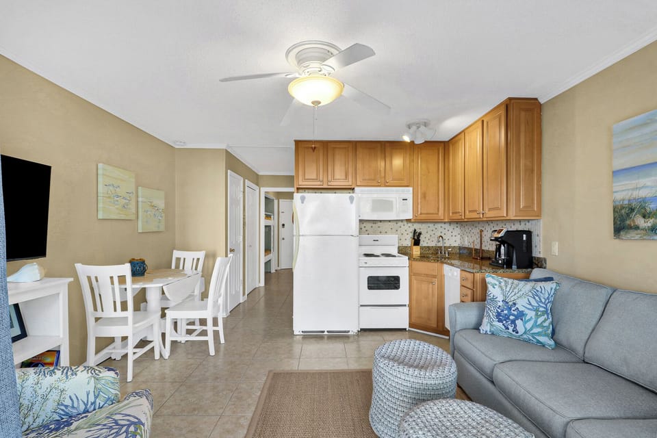 LivingRoom/Dining - Cozy living room set up perfect for gathering together or hanging out after a day at the beach. Featuring a dining area great for enjoying a meal.