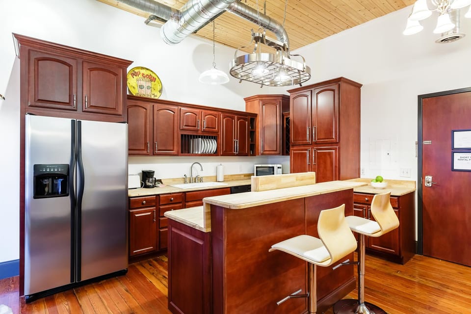 Sleek Kitchen Right Between Bed & Lounge