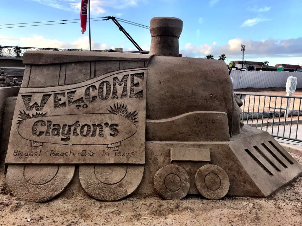A look at a sandcastle sculpture featuring Clayton's of South Padre Island.