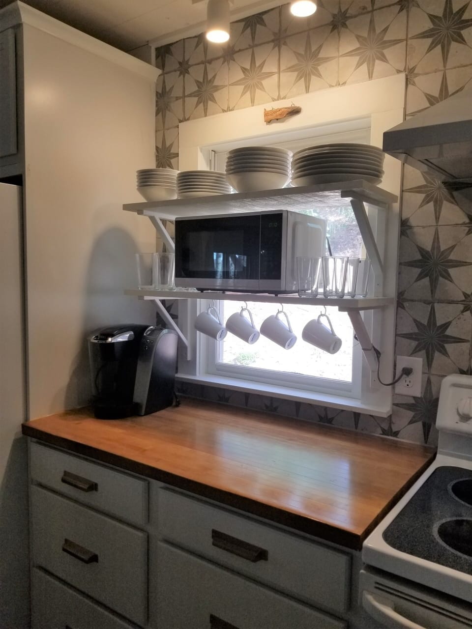 Coffee station with butcher block countertop.  Kuerig/drip coffee pot available