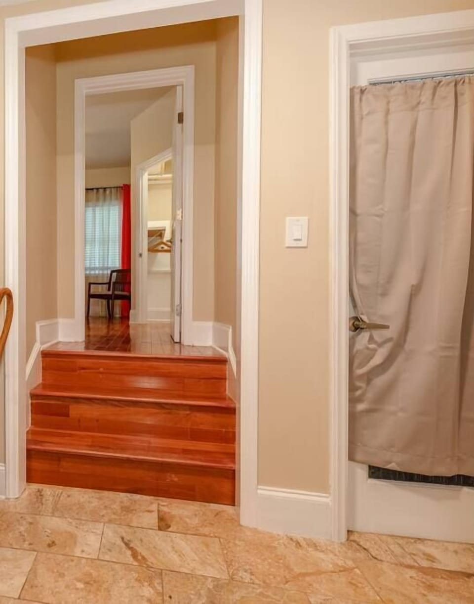 3 steps up to bedroom from kitchen (handrail on wall)