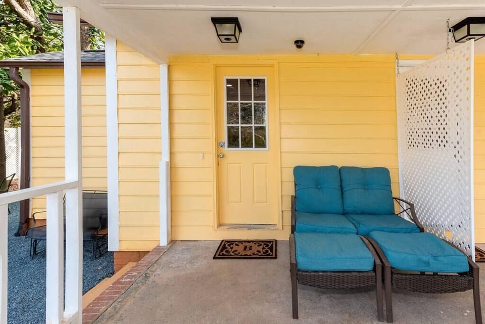 Suite B Yellow Door Front Porch entrance and steps to left