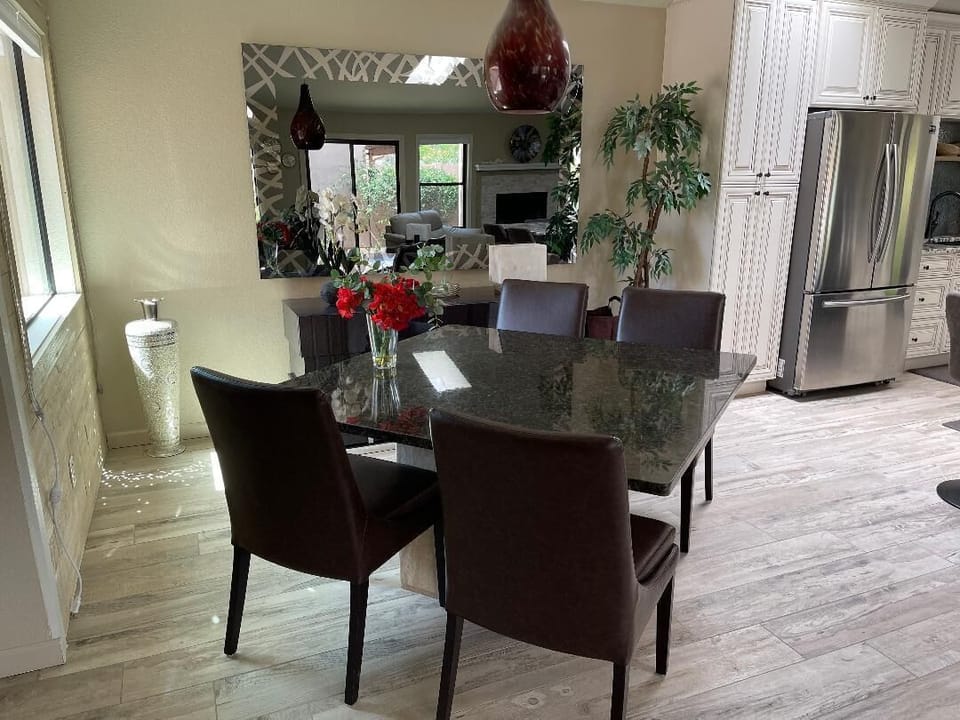 Granite Dining room Table with leather chairs