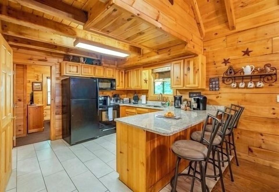 Enjoy the convenience of granite countertops, a breakfast bar with comfy high chairs, and a fully equipped kitchen to make yourself feel right at home here.