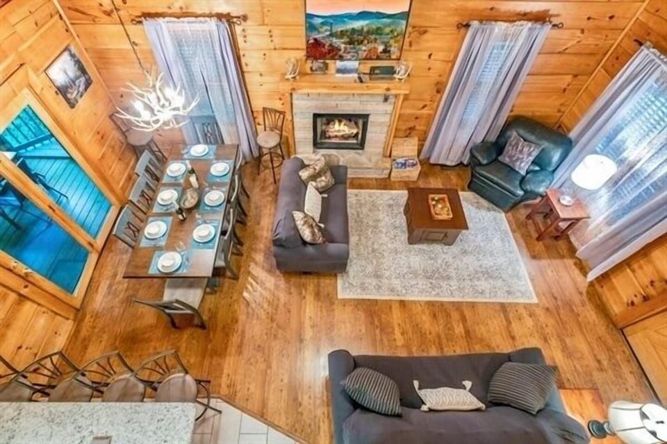 Enjoy the view from upstairs, with its high cathedral ceiling and welcoming fireplace. There's plenty of seating in the open floor living room for your entire family to relax and enjoy.