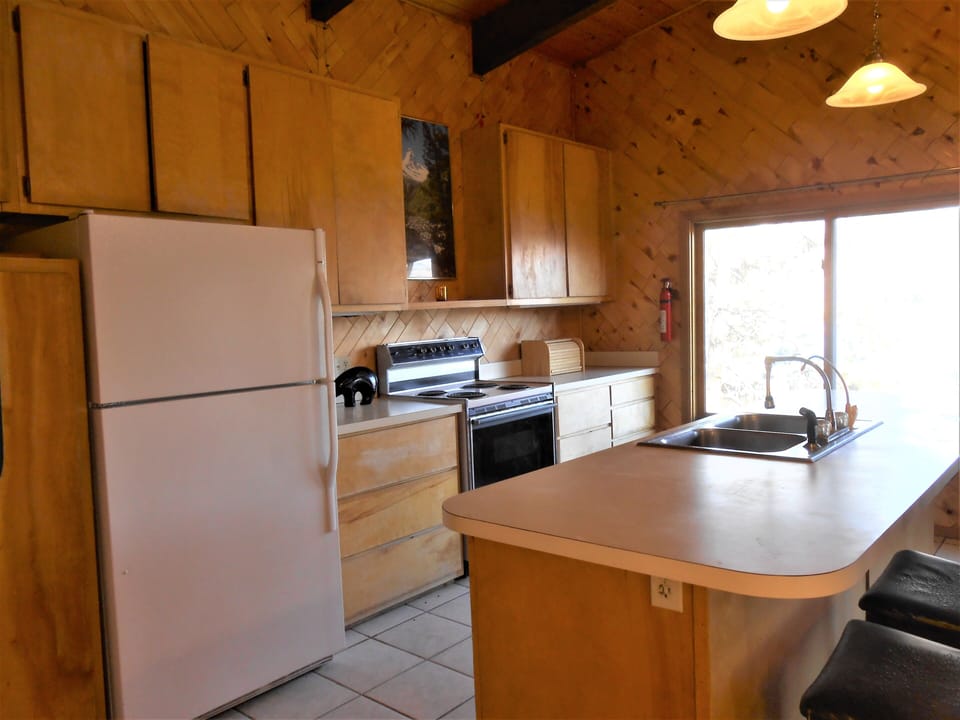 Upstairs full kitchen has the best views of the lake and beautiful hills across