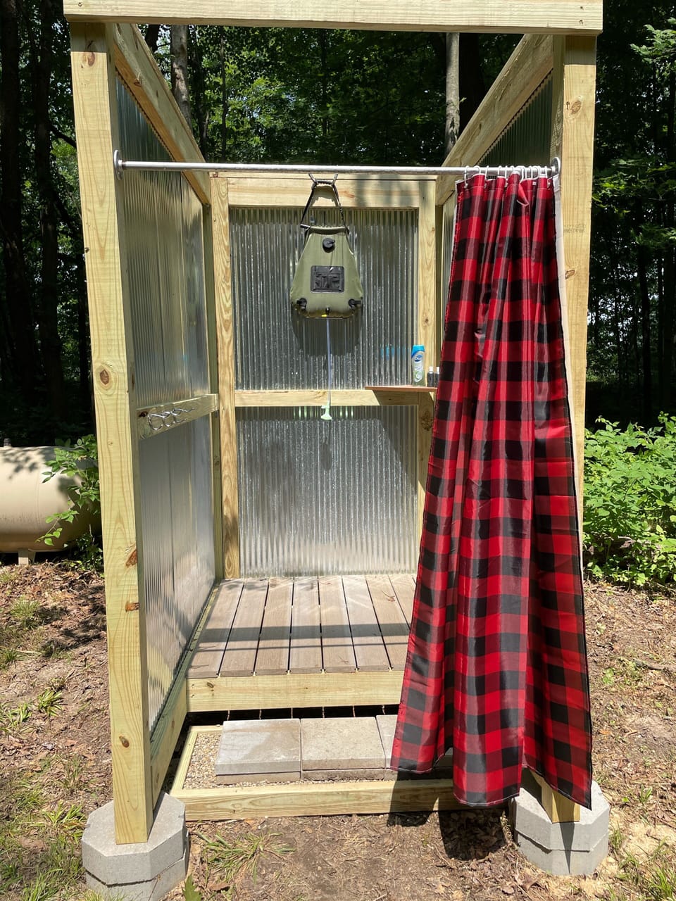 The outdoor rustic shower.