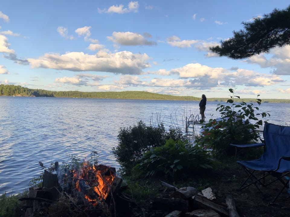 Fire pit on shore by dock