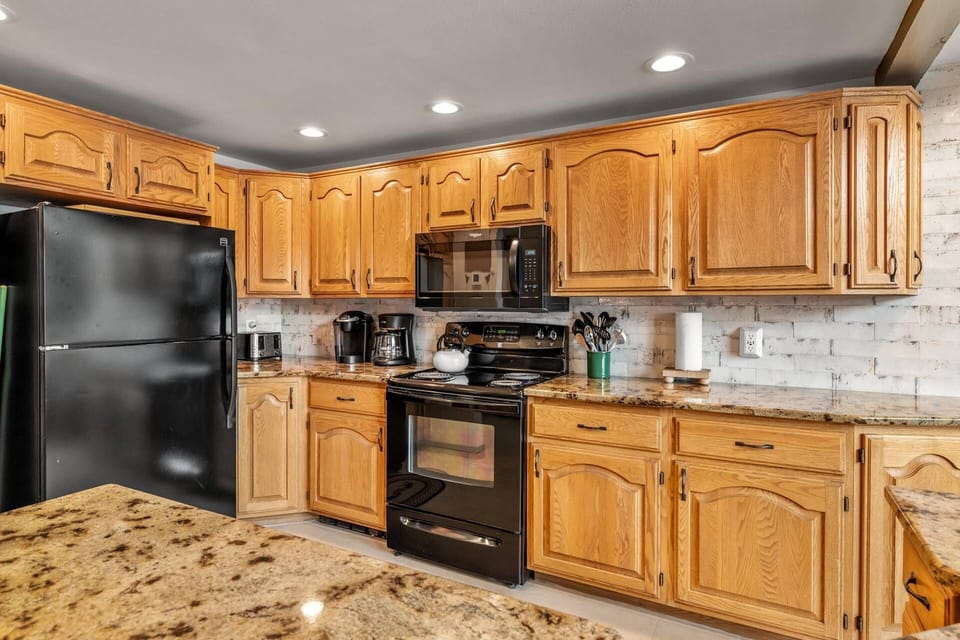 Fully equipped kitchen with beautiful granite countertops for all your culinary needs.