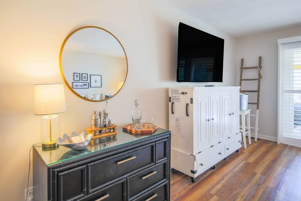 There is also a small bar area near the dining room and living room areas.