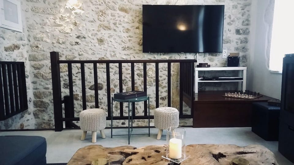 Living area. First floor living room with TV, DVD player and board games