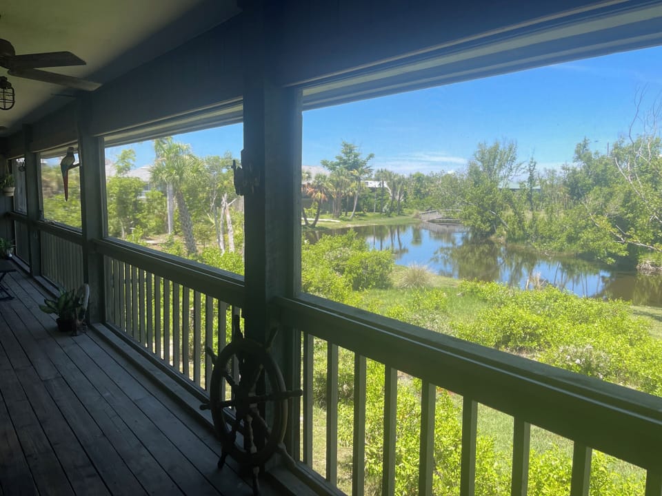 large screened upstairs porch great views of the lagoon/sunsets