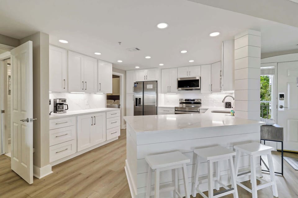 Newly remodeled kitchen fully stocked with cookware and dishware