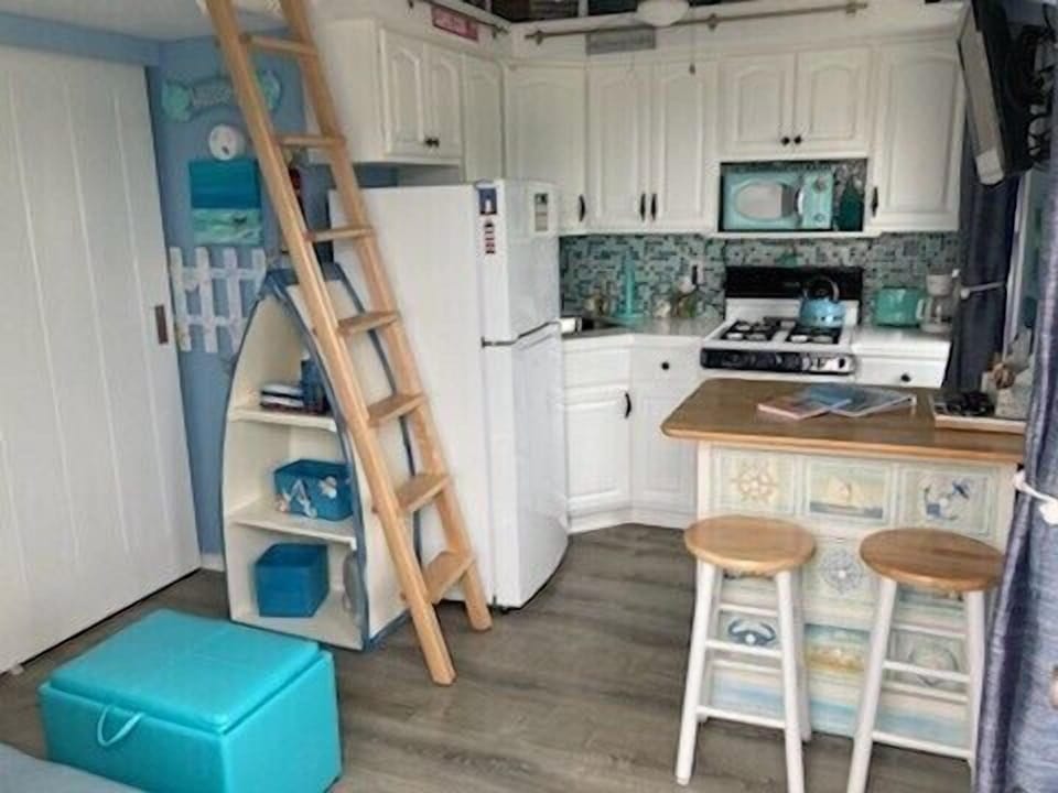 Fully equipped kitchen with gas stove and oven. An island that seats four!