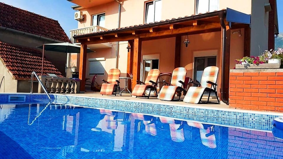 Pool. Pool area with deck chairs and a covered patio is at your disposal.