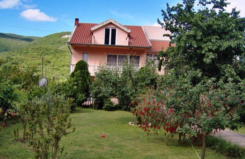 External view of the building. Beautiful garden surrounding the property.
