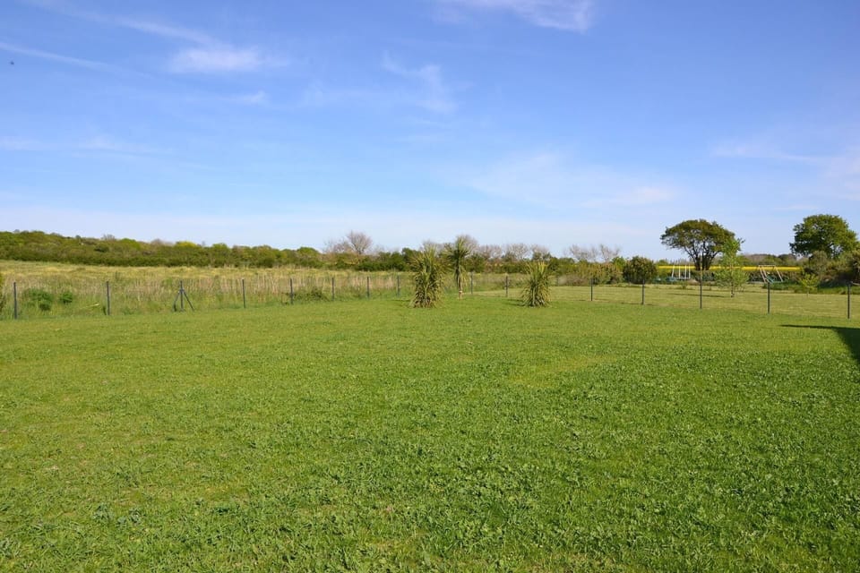 External view of the building. 1000 sq ft fenced field