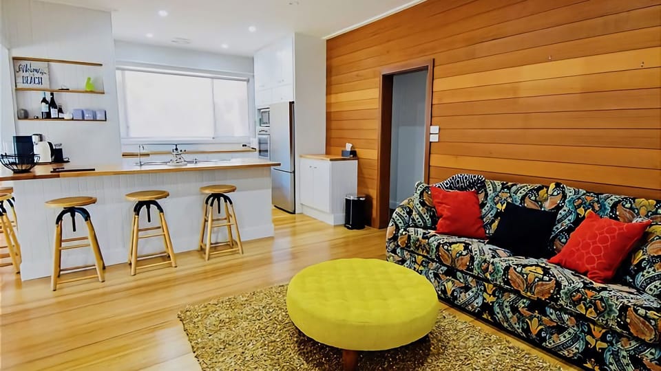 Second cozy living area with couch, perfect for getting together while a meal is being prepared.