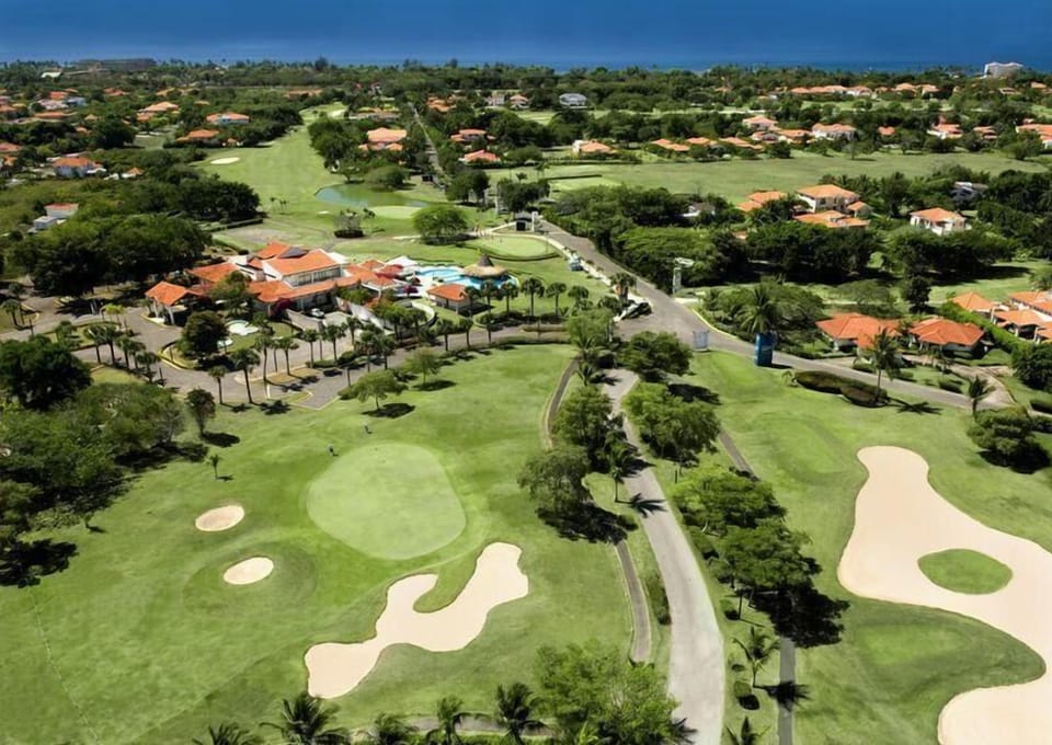 Area that directly surrounds the property. we are situated on 1 green and close to club house sports areas