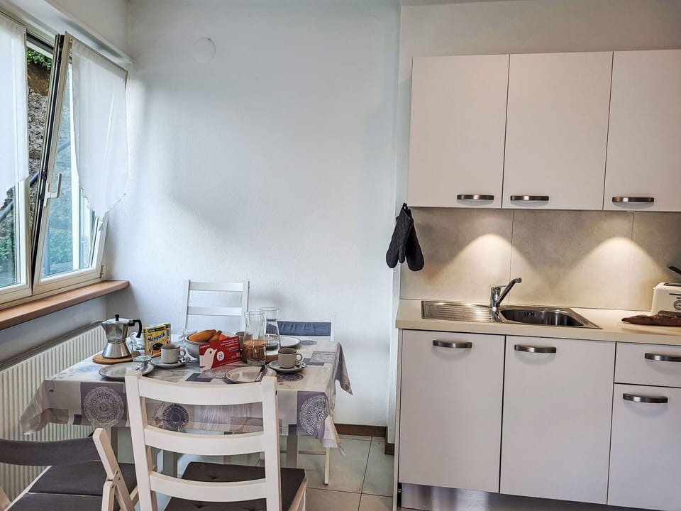 Furniture, Interior Design, Flooring, Floor, Room, Major Appliance, Kitchen Appliance, Apartment, Ceiling, Kitchen