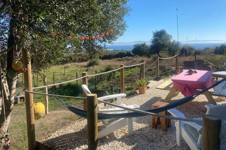 Sunny terrace with comfortable seating and breath-taking views.