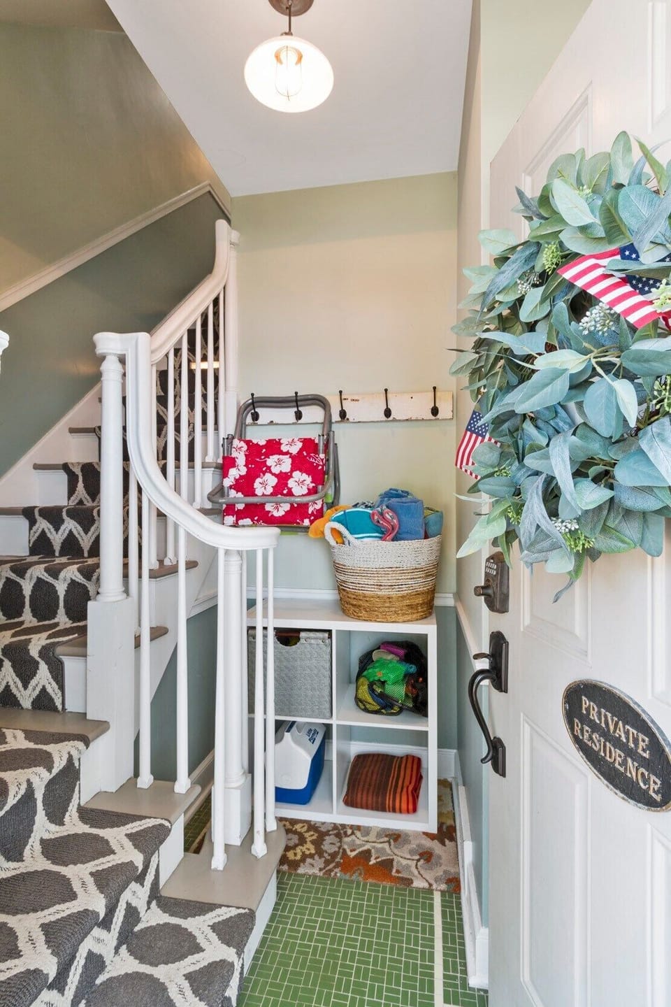 After entering, there is a stairway to the second floor of the rental.