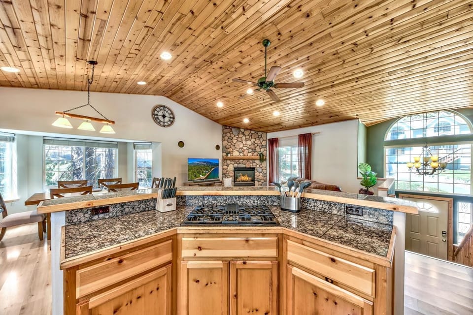 Step into your rustic kitchen where wood beams overhead create warmth while granite counters offer ample prep space for memorable meals.