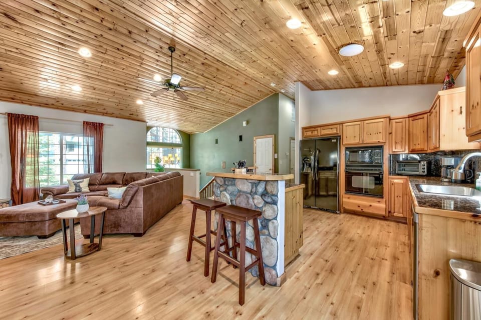 Step into your cozy mountain retreat where rustic wood ceilings and modern comforts blend perfectly for your ideal getaway.