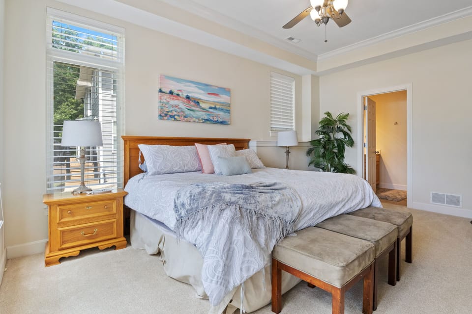 Lower Level-Spacious primary bedroom with a king bed and private bathroom