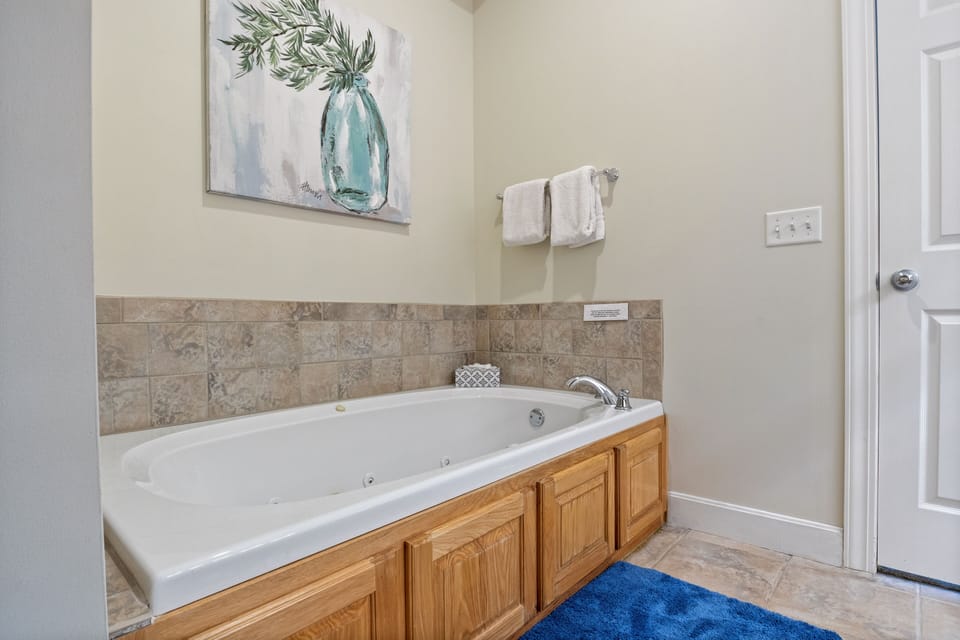 Lower Level-Spacious primary bedroom with a king bed and private bathroom