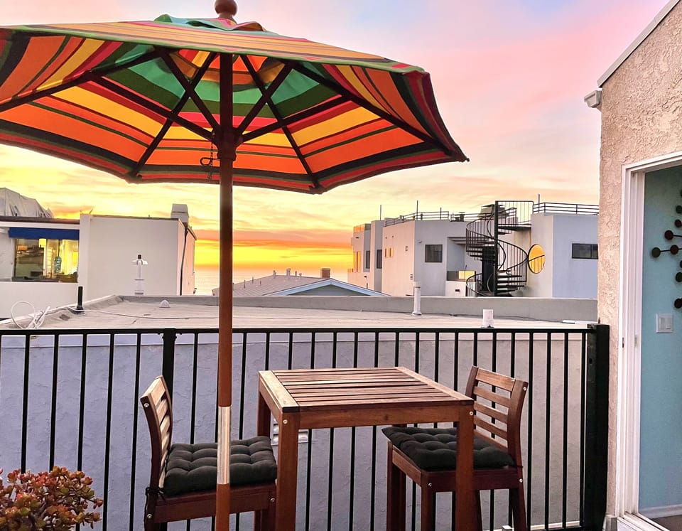 Rooftop deck with bar height table and chairs