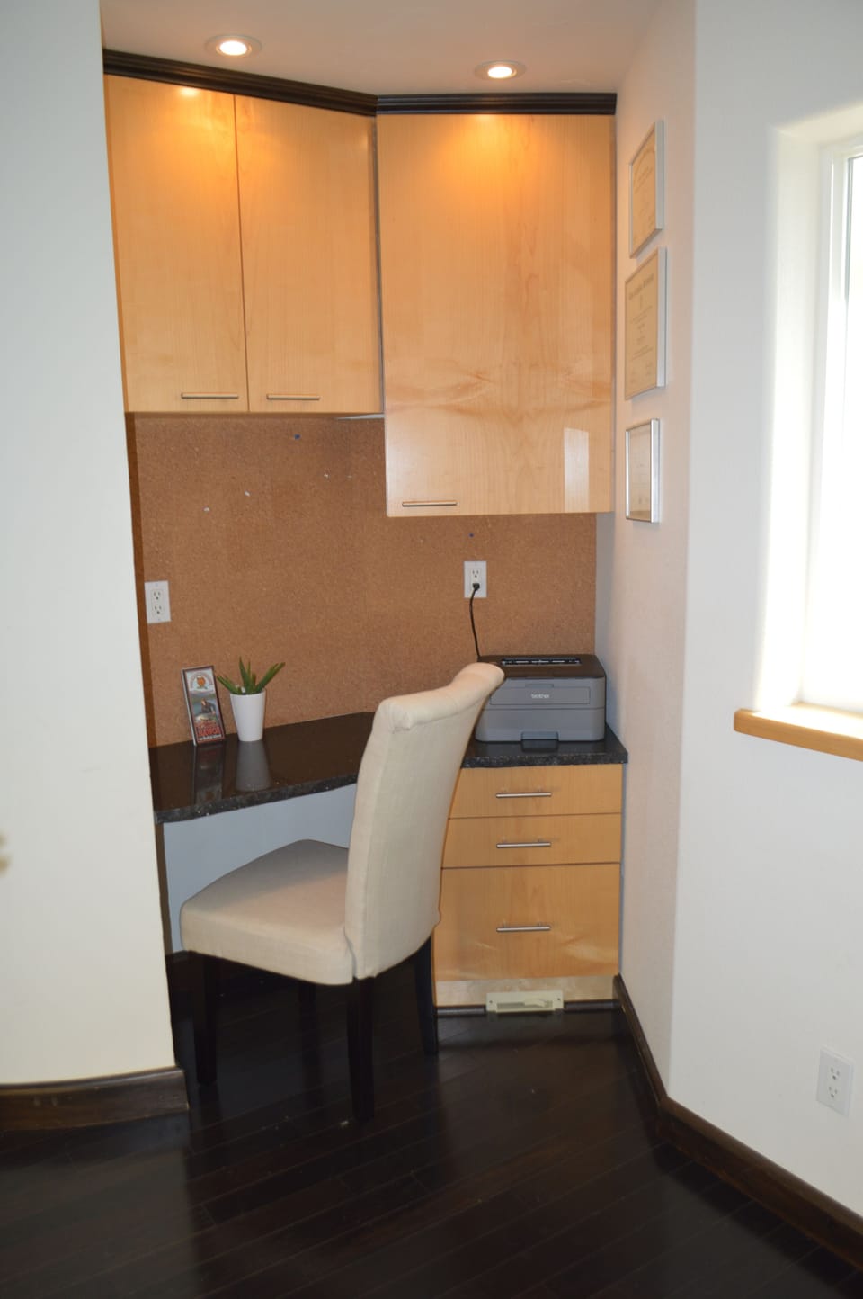 desk off kitchen with printer for guest use